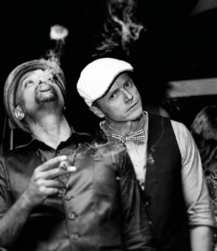 Nick and Rags on a rock with a cigar